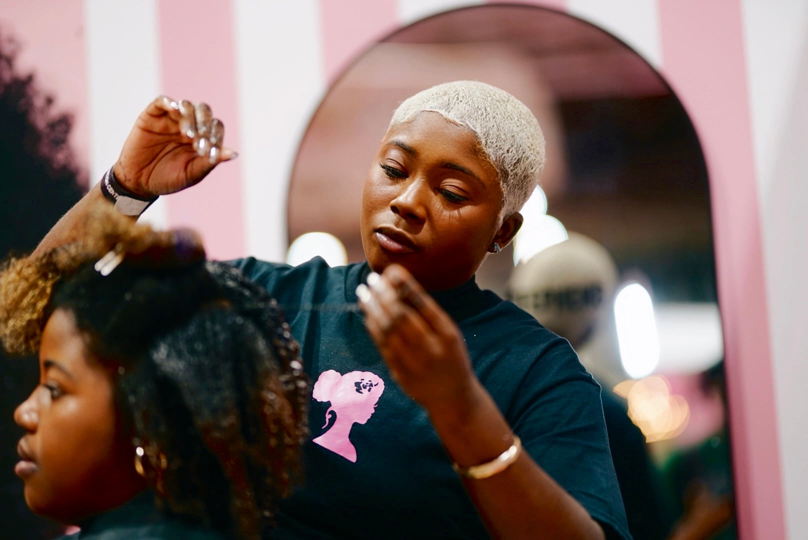 Live braiding station set up backstage at an activation