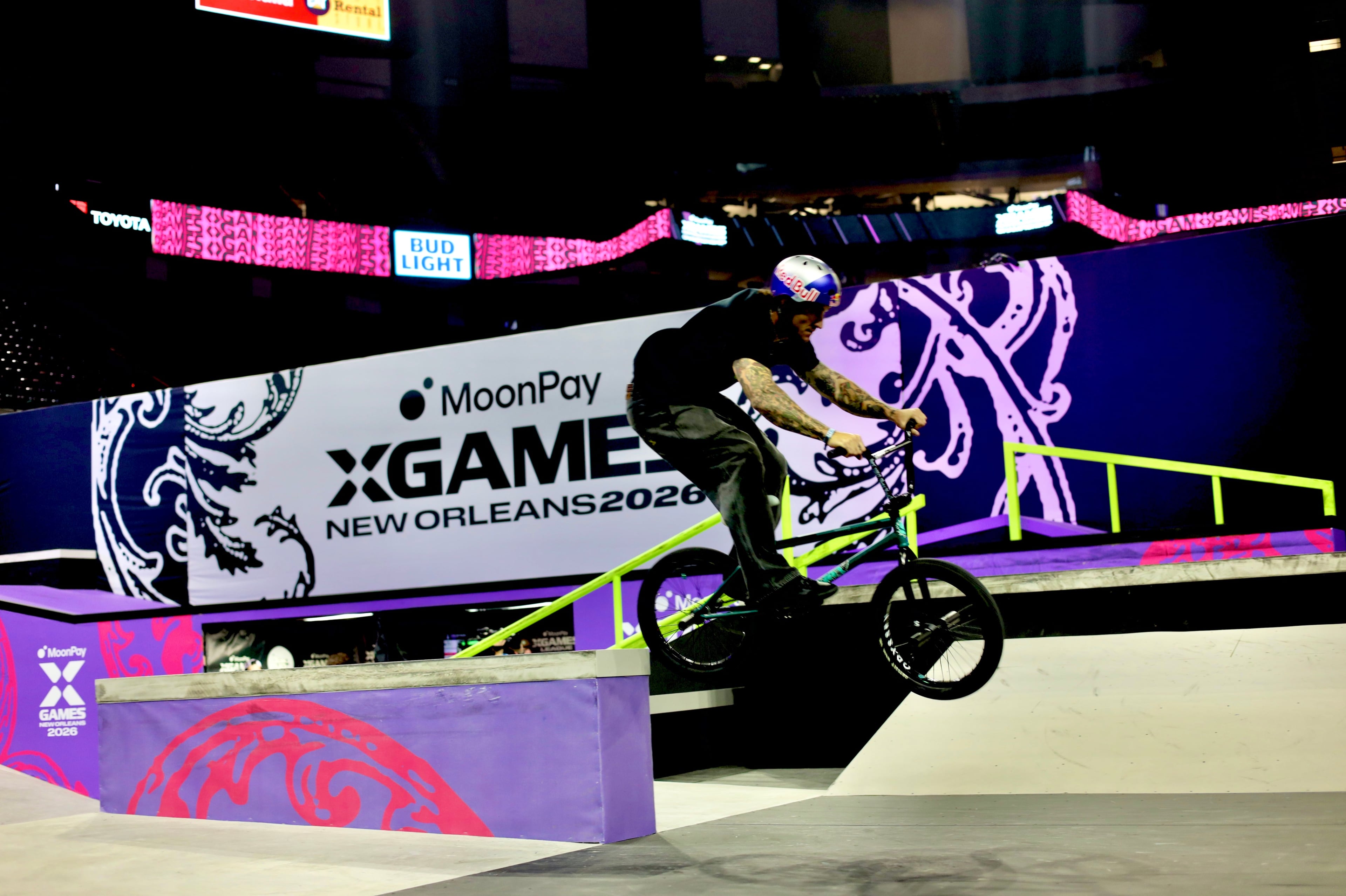 BMX rider mid-trick at a live brand activation